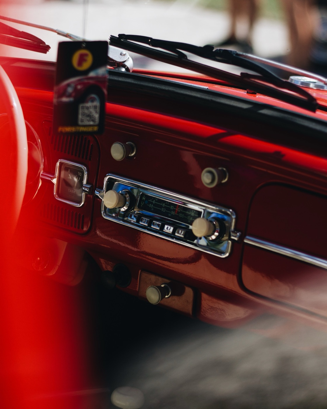 Red vintage dashboard with a chrome radio