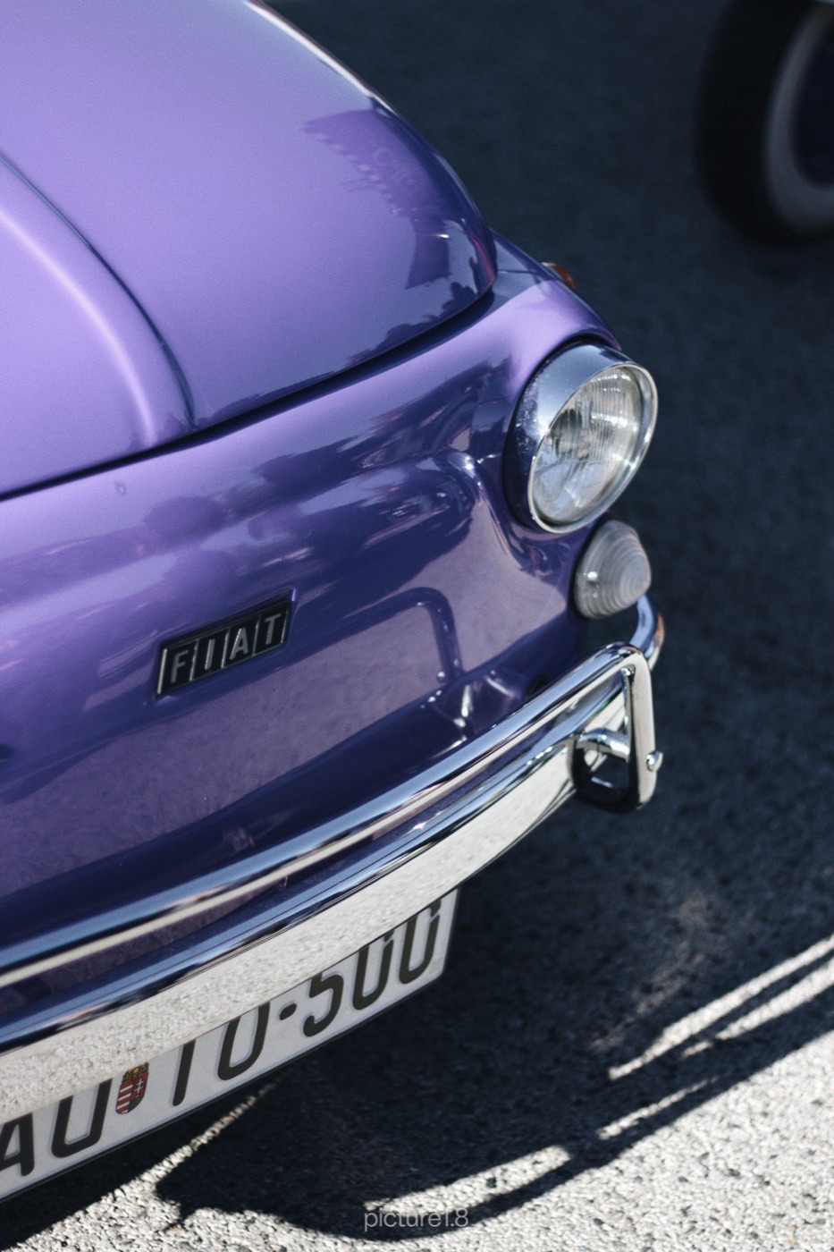 Front of a lavender vintage Fiat 500